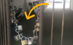 小区大门挂29把锁火了 居民：防外来车辆抢车位 各开各的锁！